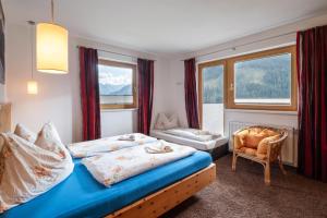 Ліжко або ліжка в номері Ahornegg