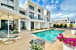 an image of a house with a swimming pool at White Lion Apartment N2 Kallithea in Kallithea Halkidikis