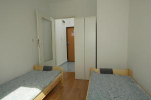 Łóżko lub łóżka w pokoju w obiekcie Apartament Słoneczny 7