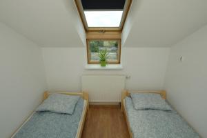 Łóżko lub łóżka w pokoju w obiekcie Apartament Słoneczny 7