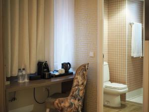 Um banheiro em THE ONE Grand Hotel da Póvoa - by MHMB Hospitality