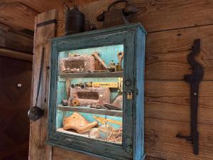 a blue cabinet filled with tools on a wall at Romantik Hotel U Raka in Prague