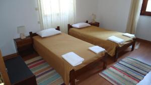 A bed or beds in a room at Nymph
