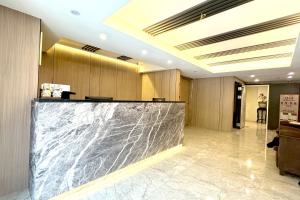 a lobby with a marble counter in a building at Dafong Hotel in Zhongzheng