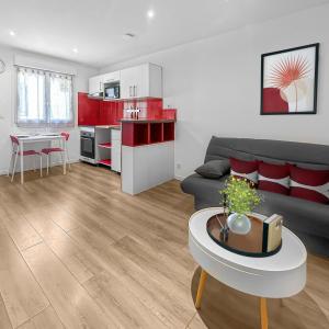 a living room with a couch and a table at Retraite Bucolique à Leyment in Leyment +5 photos