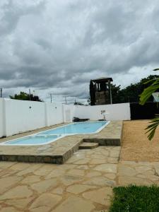 a swimming pool in the backyard of a house at Tulivu Suites Diani in Ukunda