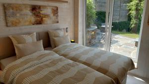 Postel nebo postele na pokoji v ubytování Villa Escape