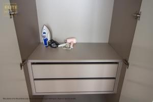 a locker room with a door with a toilet paper holder at PAVILION EMBASSY KLCC By ELITE HOST in Kuala Lumpur
