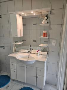 a bathroom with a sink and a mirror at House Tereza near Olimje, Podčetrtek in Pristava pri Mestinju +22 photos