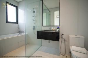 a bathroom with a shower and a sink and a toilet at PAVILION EMBASSY KLCC By ELITE HOST in Kuala Lumpur