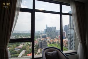 a window with a view of a city at PAVILION EMBASSY KLCC By ELITE HOST in Kuala Lumpur