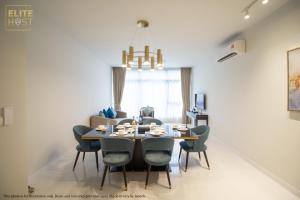 a dining room with a table and chairs at PAVILION EMBASSY KLCC By ELITE HOST in Kuala Lumpur