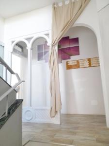 a room with a window and a staircase at BioBenessere Eco-B&B -Adults Only- Moto&Bike Parking in Arezzo