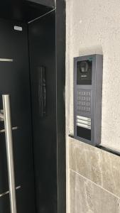 a pay phone on the side of a building at Urbano in Haifa