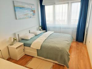 Postel nebo postele na pokoji v ubytování Sunflower Sky Apartment