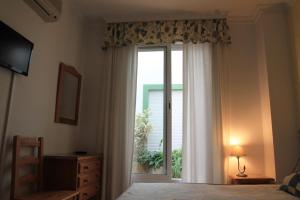 Postel nebo postele na pokoji v ubytování Hostal Ana - Adults Recommended