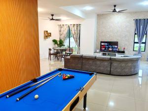 a living room with a pool table and a couch at 15-19Pax SemiD Near Highwy W/Pool Table&Karaoke in Ipoh
