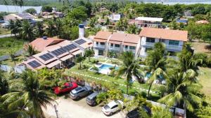 an aerial view of a house with a parking lot at Pousada Villa Minduba in Japaratinga