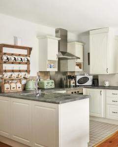 Photo de la galerie de l'établissement Old Stable Mews Castle Leslie, à Glaslough 29 autres photos