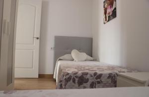 Posteľ alebo postele v izbe v ubytovaní Apartamento en Conil con piscina