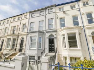 a white building with stairs in front of it at Station House in Scarborough