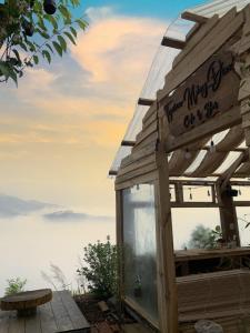 a wooden shed with a sign that reads there might be coffee on it at TopView Măng Đen in Kon Von Kla