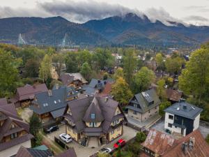 an aerial view of a town with mountains in the background at Willa Znana Zakopane in Zakopane