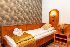 Postel nebo postele na pokoji v ubytování Hotel Rossija