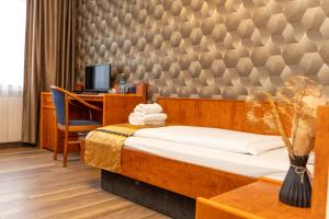 Postel nebo postele na pokoji v ubytování Hotel Rossija
