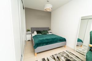 Postel nebo postele na pokoji v ubytování Apartview Bukowa III by Rent like home