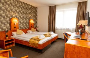 Postel nebo postele na pokoji v ubytování Hotel Rossija