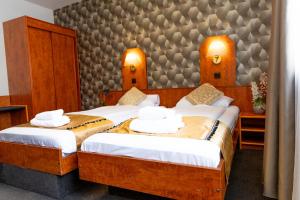 Postel nebo postele na pokoji v ubytování Hotel Rossija