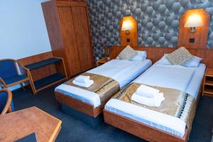 Postel nebo postele na pokoji v ubytování Hotel Rossija