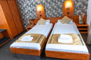 Postel nebo postele na pokoji v ubytování Hotel Rossija