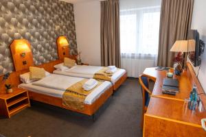 Postel nebo postele na pokoji v ubytování Hotel Rossija