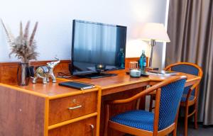 TV a/nebo společenská místnost v ubytování Hotel Rossija