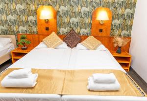 Postel nebo postele na pokoji v ubytování Hotel Rossija