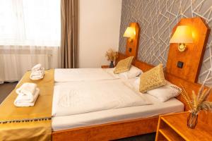 Postel nebo postele na pokoji v ubytování Hotel Rossija
