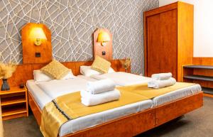 Postel nebo postele na pokoji v ubytování Hotel Rossija
