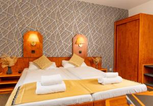 Postel nebo postele na pokoji v ubytování Hotel Rossija