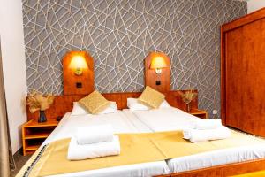Postel nebo postele na pokoji v ubytování Hotel Rossija