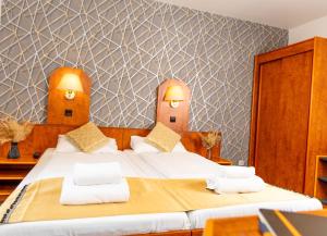 Postel nebo postele na pokoji v ubytování Hotel Rossija