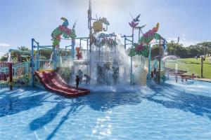 a water park with a slide in the water at Utopia in Palm Beach in Port Edward