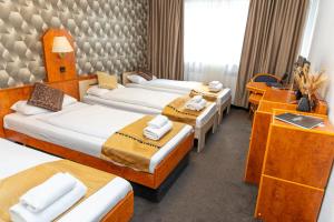 Postel nebo postele na pokoji v ubytování Hotel Rossija