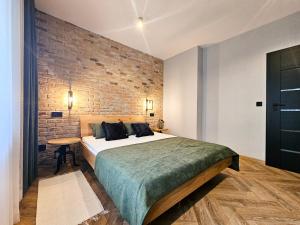 Łóżko lub łóżka w pokoju w obiekcie visit baltic - Rezydencja Sienkiewicza Loft przy plaży