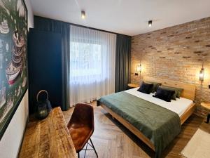 Łóżko lub łóżka w pokoju w obiekcie visit baltic - Rezydencja Sienkiewicza Loft przy plaży