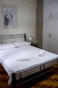 Postel nebo postele na pokoji v ubytování Didima Apartments 1