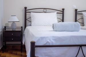 Postel nebo postele na pokoji v ubytování Didima Apartments 1
