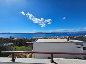 a view of a body of water from a building at Apartments Lujić in Crikvenica
