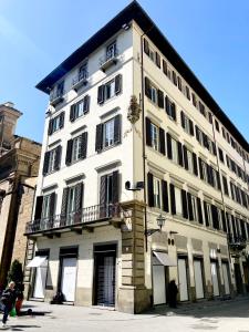 a large white building with a balcony at Borgia di Firenze in Florence
